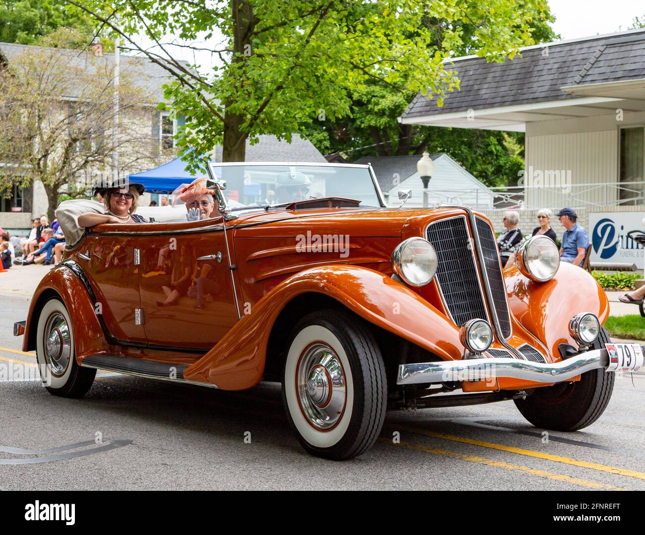 An antique orange 1934 Auburn 652Y Phaeton LF passes through Auburn ...