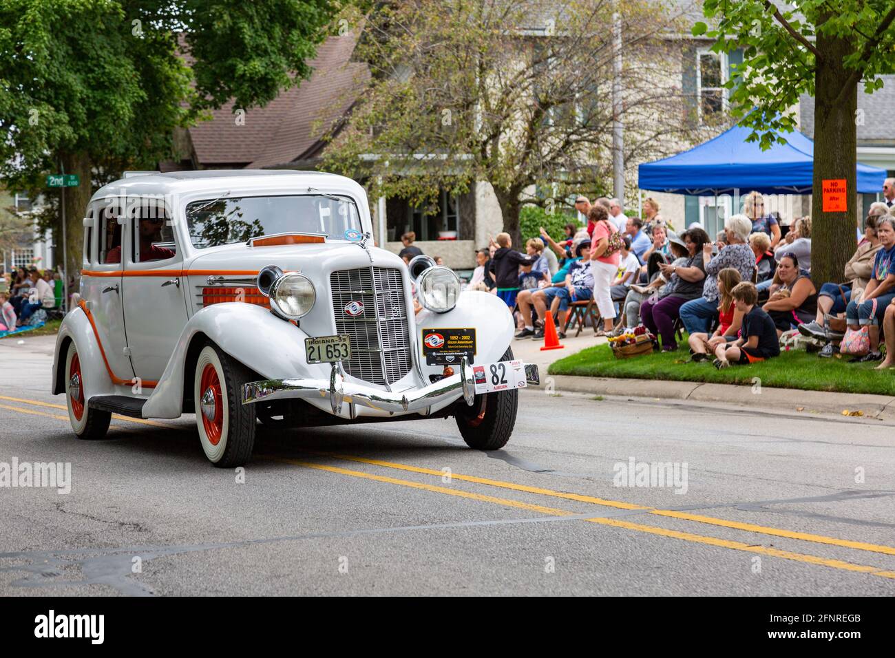 A white 1935 Auburn 653 sedan passes through Auburn, Indiana during the 2019 Auburn Cord Duesenberg Festival Parade. Stock Photo