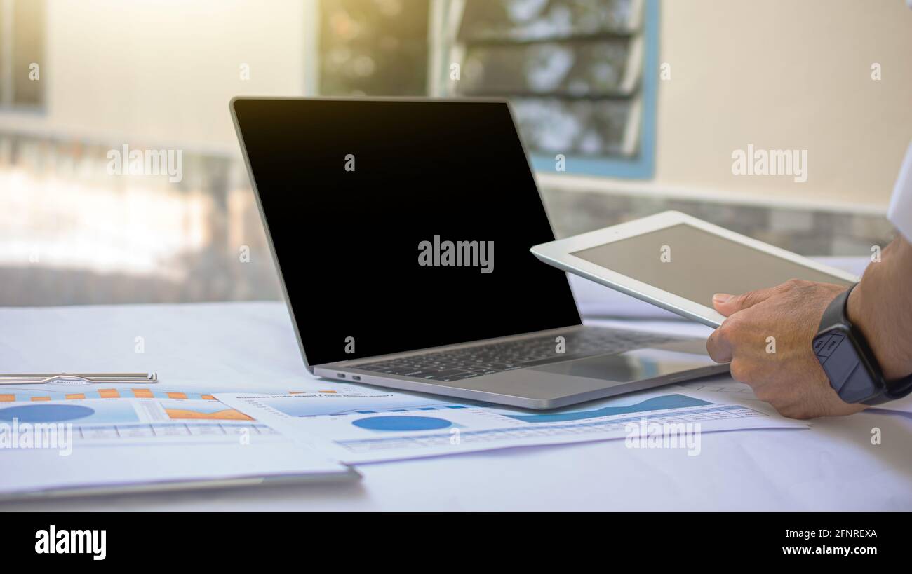 Businesspeople working by computer tablet technology Stock Photo - Alamy