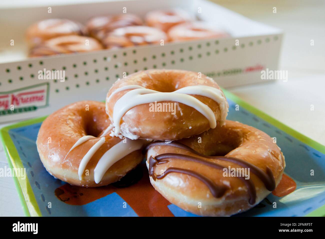 Krispy Kreme donuts on plate - USA Stock Photo
