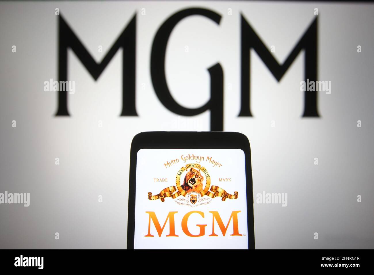 Ukraine. 18th May, 2021. In this photo illustration the Metro-Goldwyn-Mayer (MGM) logo of US media company is seen on a smartphone and a pc screen. (Photo by Pavlo Gonchar/SOPA Images/Sipa USA) Credit: Sipa USA/Alamy Live News Stock Photo