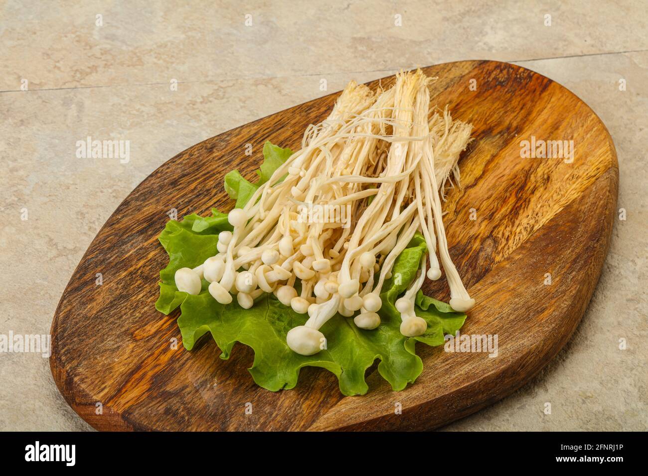 Raw Japanese Enoki mushrooms for cooking Stock Photo Alamy