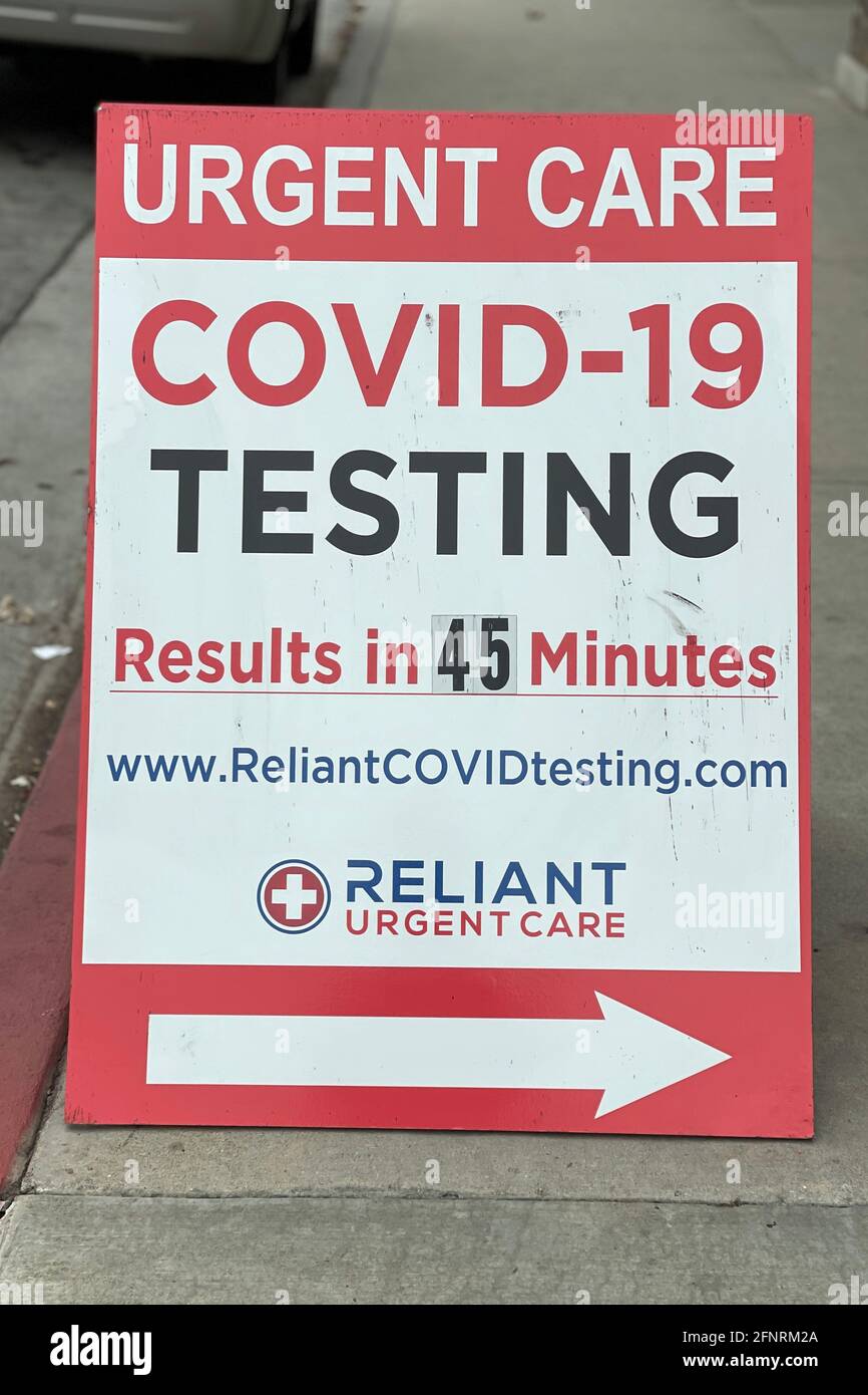A COVID-19 testing sign at Reliant Urgent Care center, Monday, May 17, 2021, in Montebello, Calif. Stock Photo