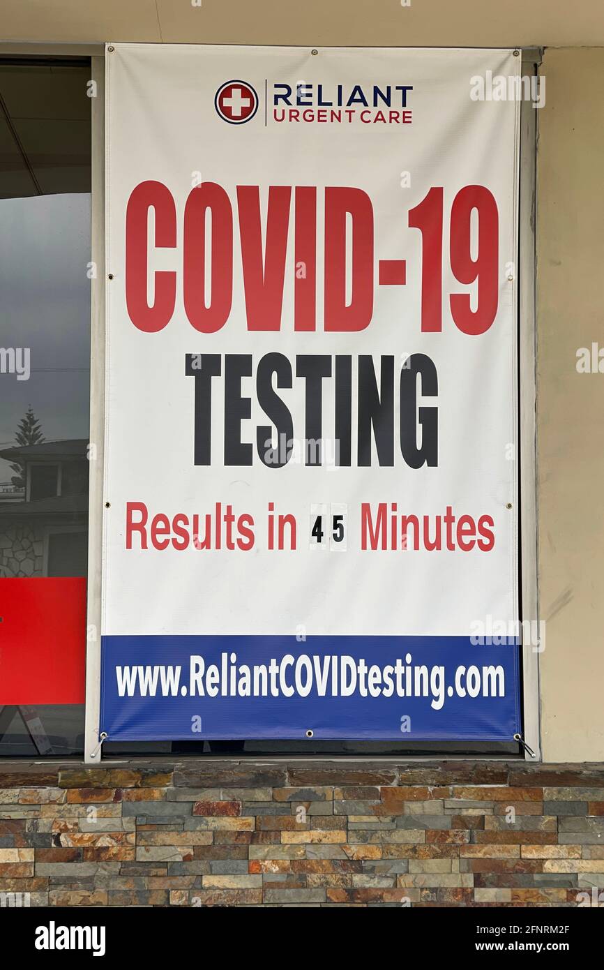 A COVID-19 testing sign at Reliant Urgent Care center, Monday, May 17, 2021, in Montebello, Calif. Stock Photo