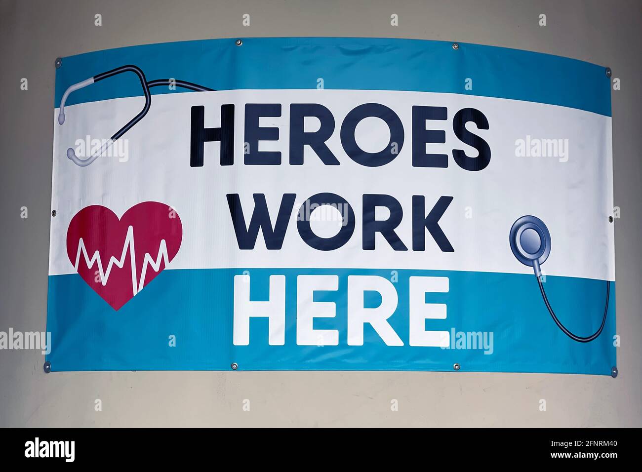 A Heroes Work Here sign at Reliant Urgent Care center, Monday, May 17, 2021, in Montebello, Calif. Stock Photo