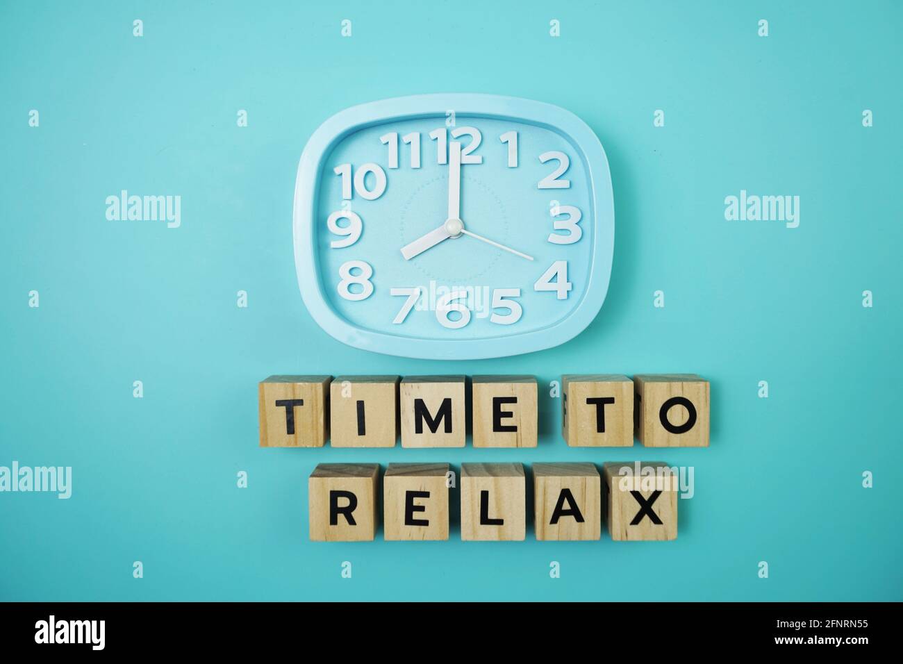 Time To Relax alphabet letter with alarm clock on blue background Stock ...
