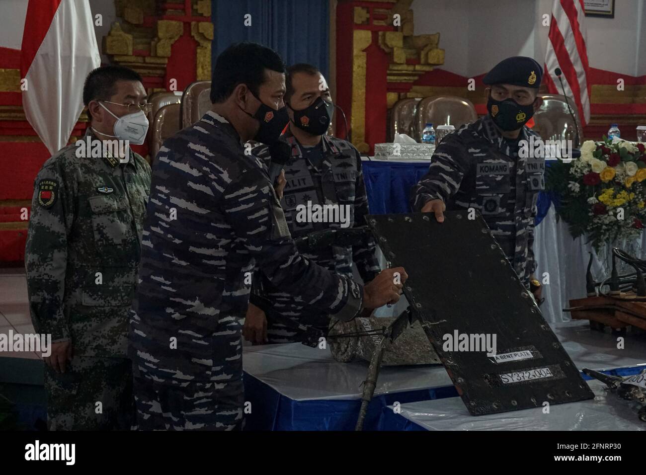 May 18, 2021, Denpasar, Bali, Indonesia: Commander of Indonesian Navy II  Fleet, Rear Admiral IWAN ISNURWANTO (two from left) explains the found  parts. Commander of Indonesian Navy II Fleet, Rear Admiral IWAN