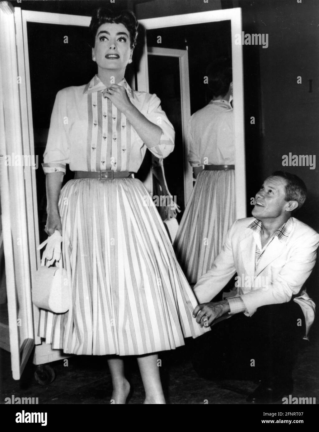 1966 Press Photo Designer Jean Louis showcasing his fall gowns collection,  Texas