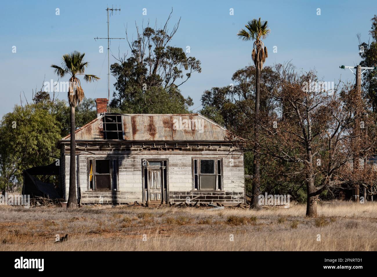 Abandoned house in rural Victoria. An abandoned house sits by a railway line in rural Victoria , Australia . Stock Photo