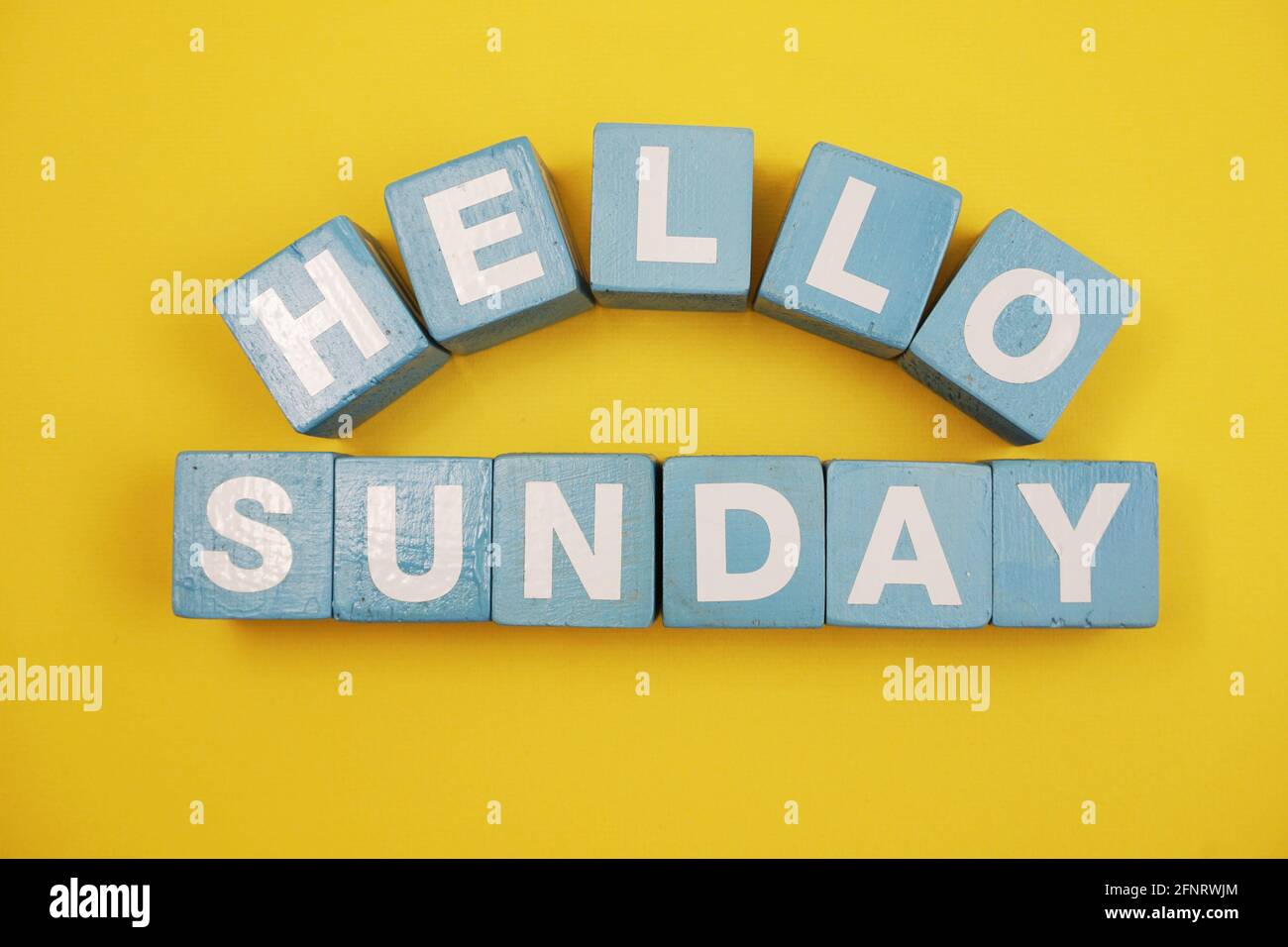 Hello Sunday alphabet letters on yellow background Stock Photo - Alamy