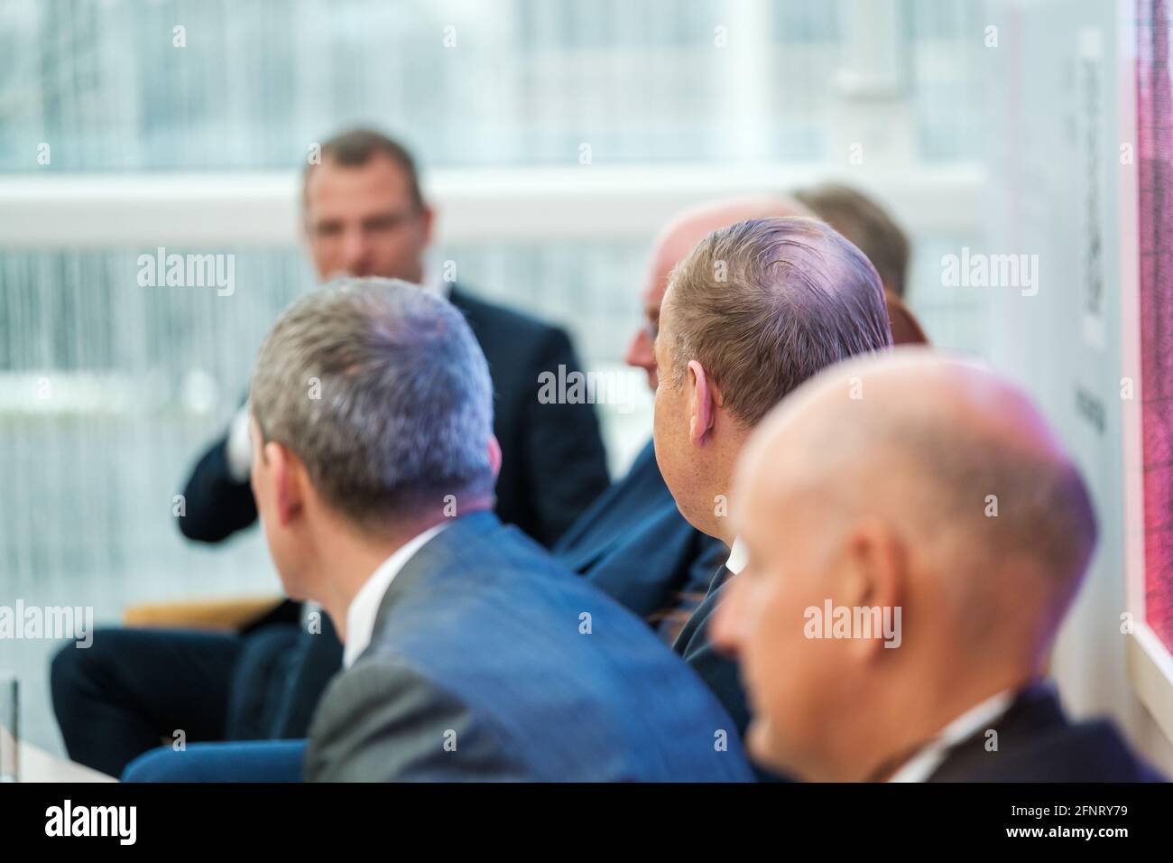 Businessmen discussing ideas during conference Stock Photo