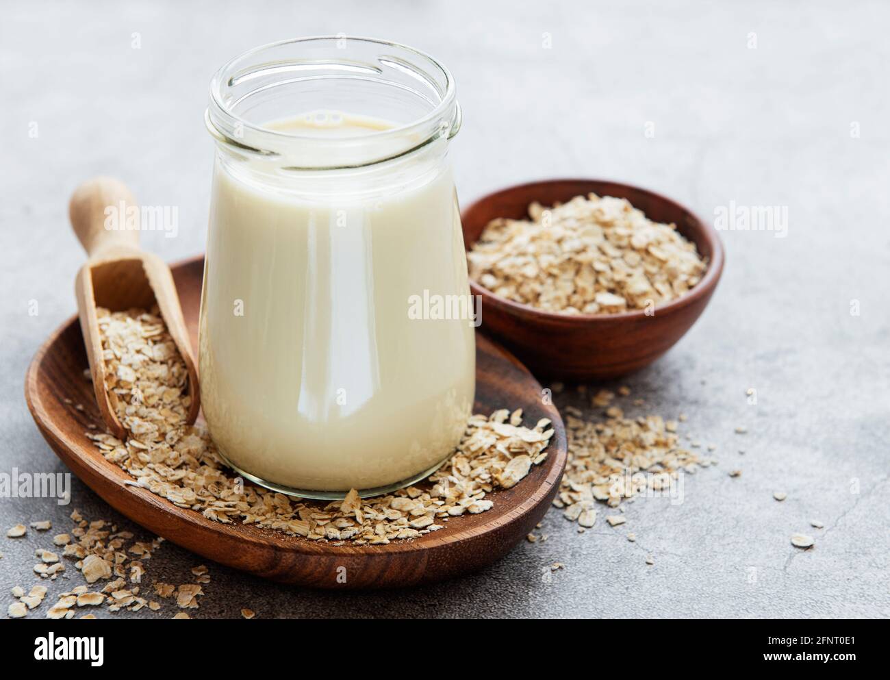 Vegan non dairy alternative milk. Oat flakes milk Stock Photo Alamy
