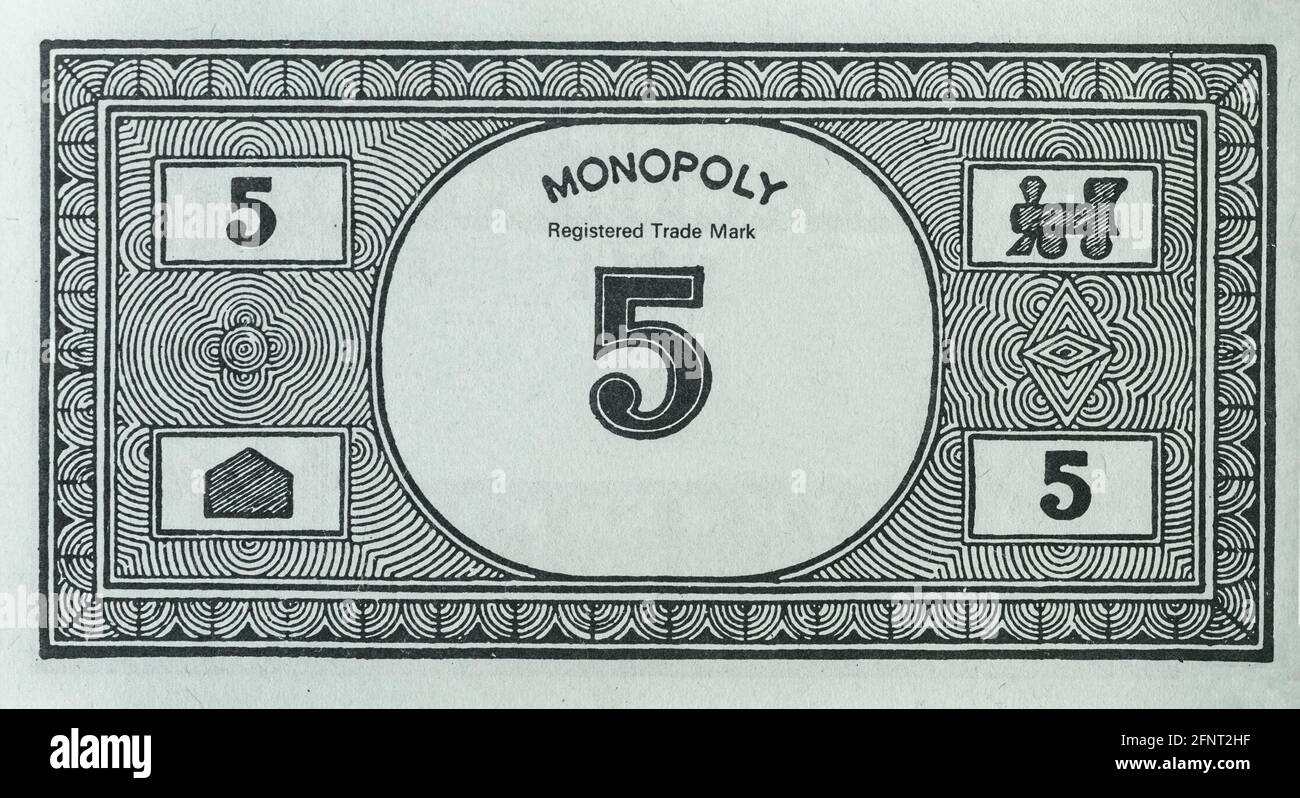 Five units Monopoly Money Note Close up Stock Photo