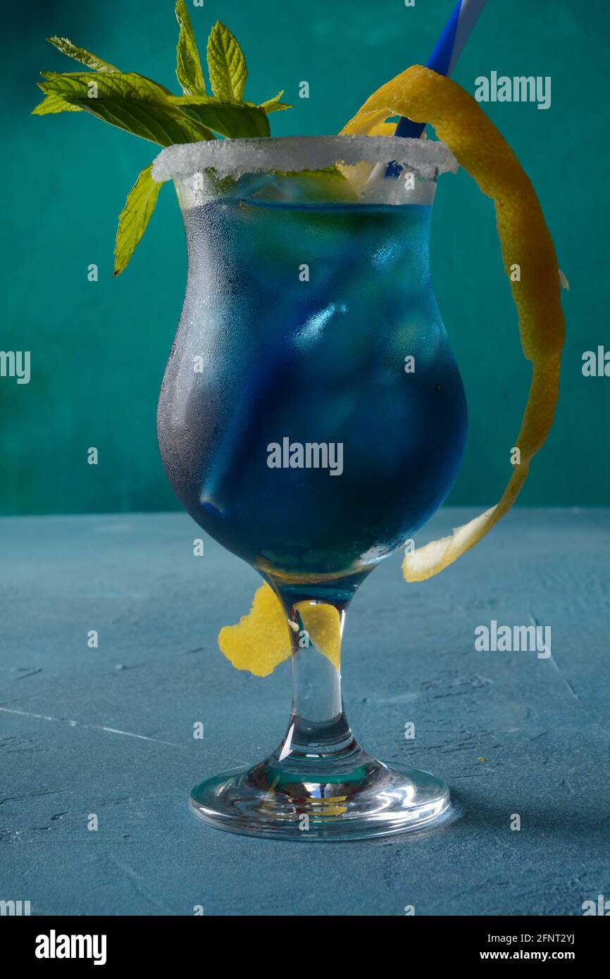 Blue lagoon cocktail with blue curacao liqueur, vodka, lemon juice and