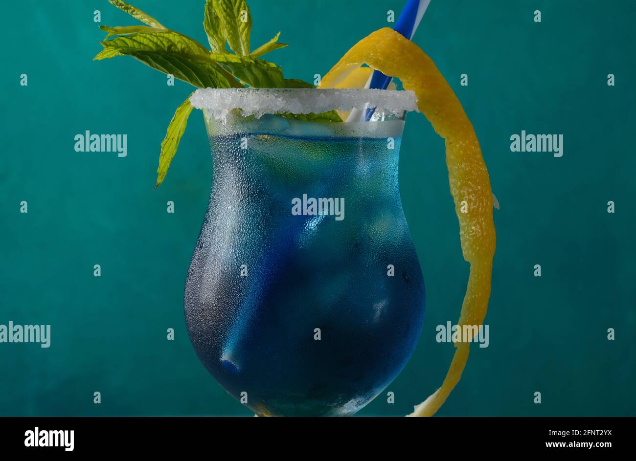 Blue lagoon cocktail with blue curacao liqueur, vodka, lemon juice and