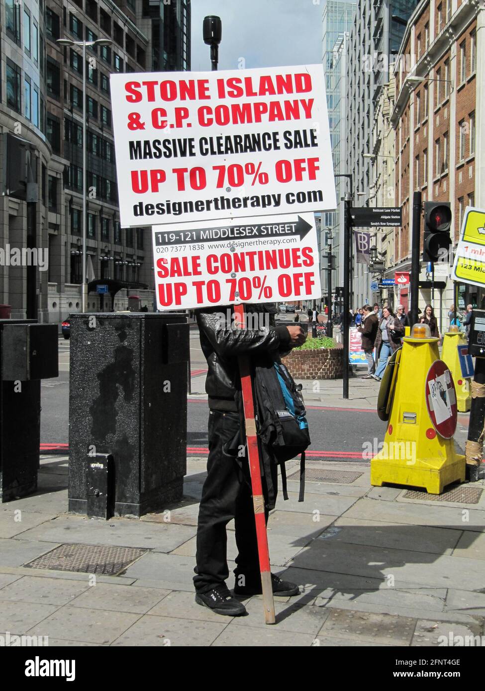Standing Man on a street advertising 70% off Sales, London, UK Stock Photo  - Alamy