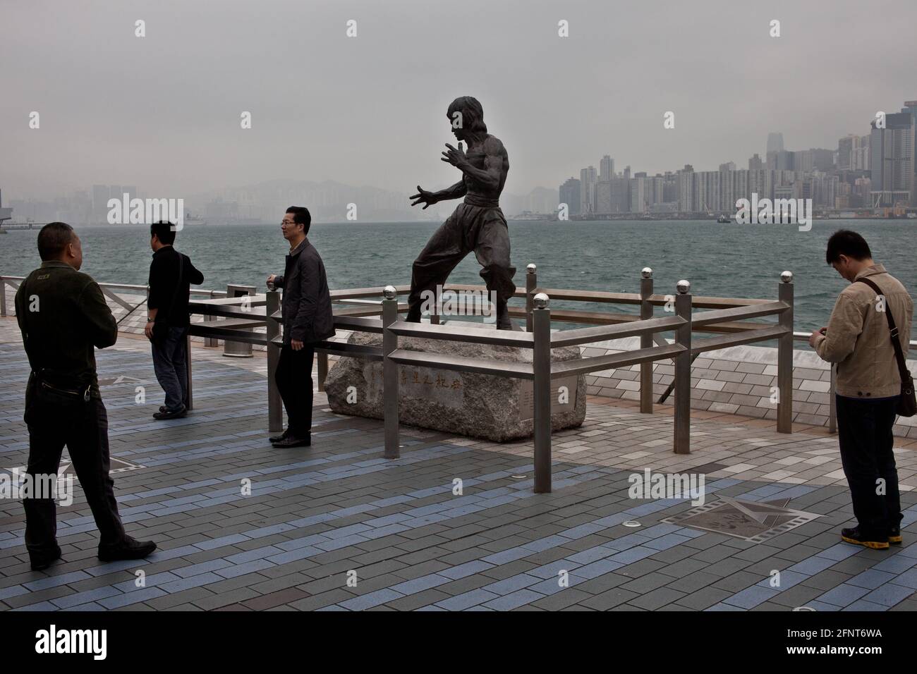 The statue of Bruce Lee in the avenue of the stars, along the Victoria Harbour waterfront in Kowloon, Hong Kong Stock Photo