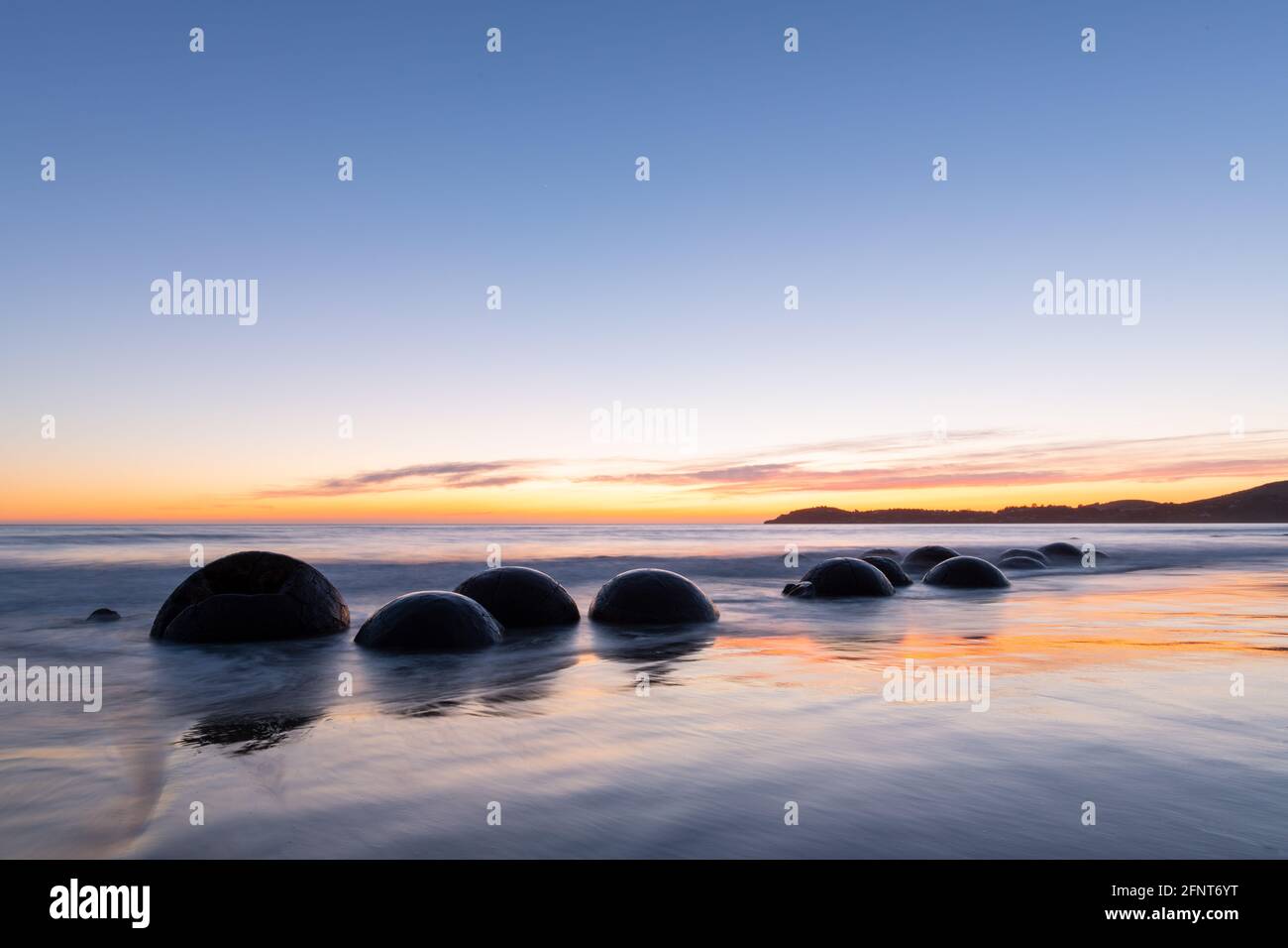 Moeraki boulders at sunrise Stock Photo