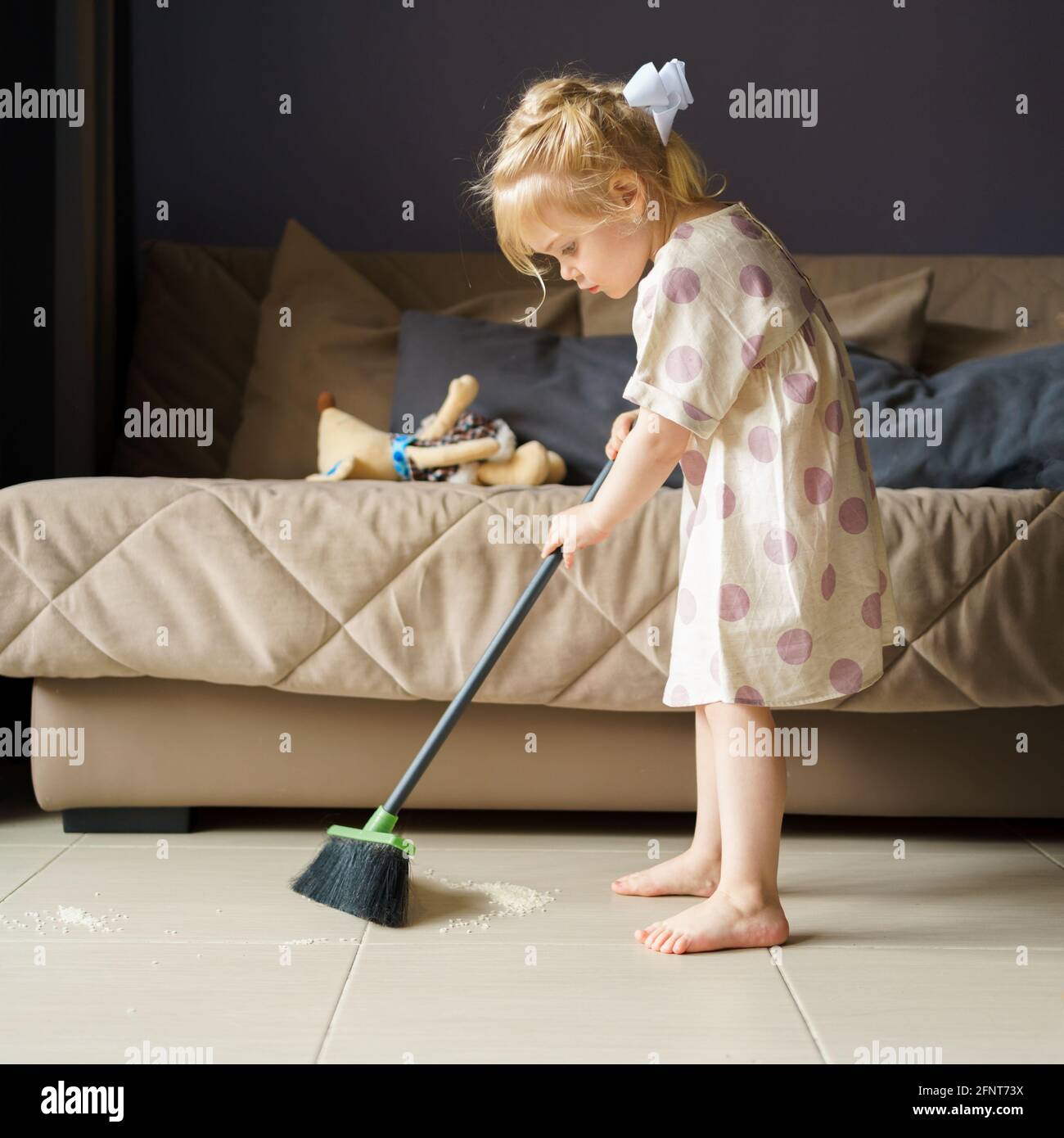 Young child doing house chores at home. Asian baby boy sweeping floor with  broom Stock Photo - Alamy