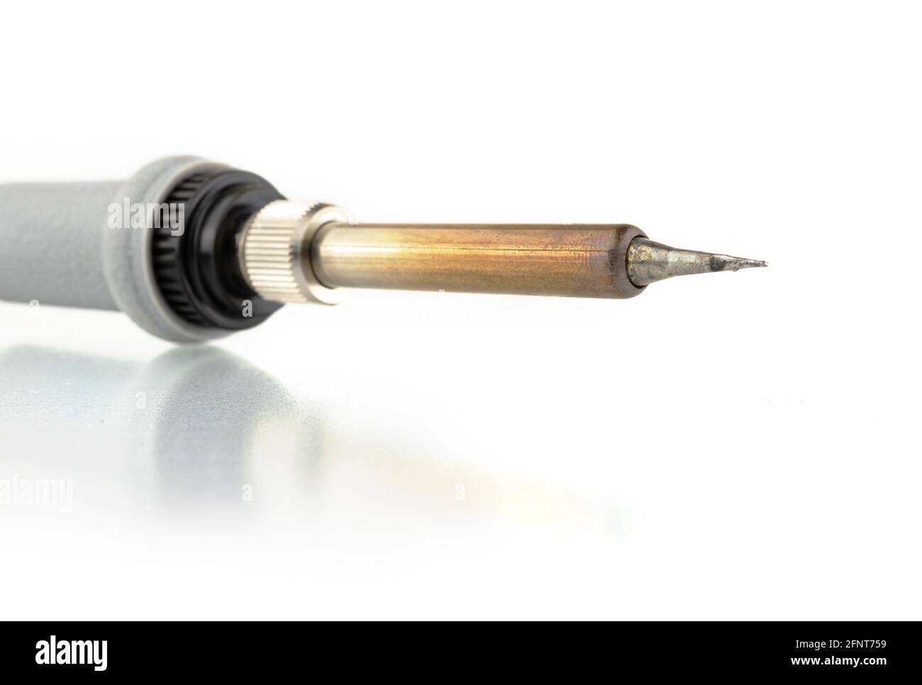 Soldering iron equipment tool isolate on a white background with reflection, close-up Stock Photo
