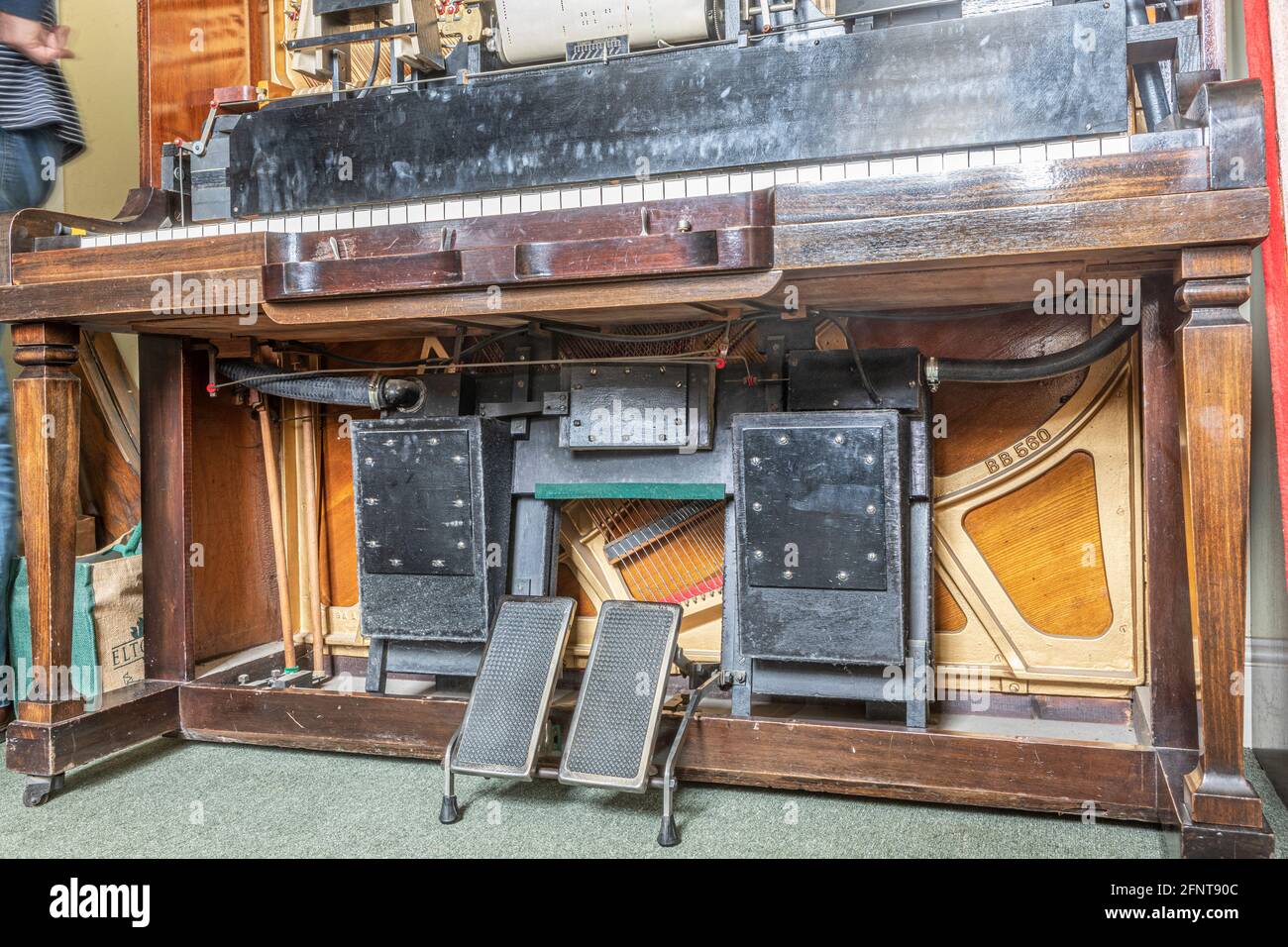 The footpedals and pumps on a pianola Stock Photo Alamy