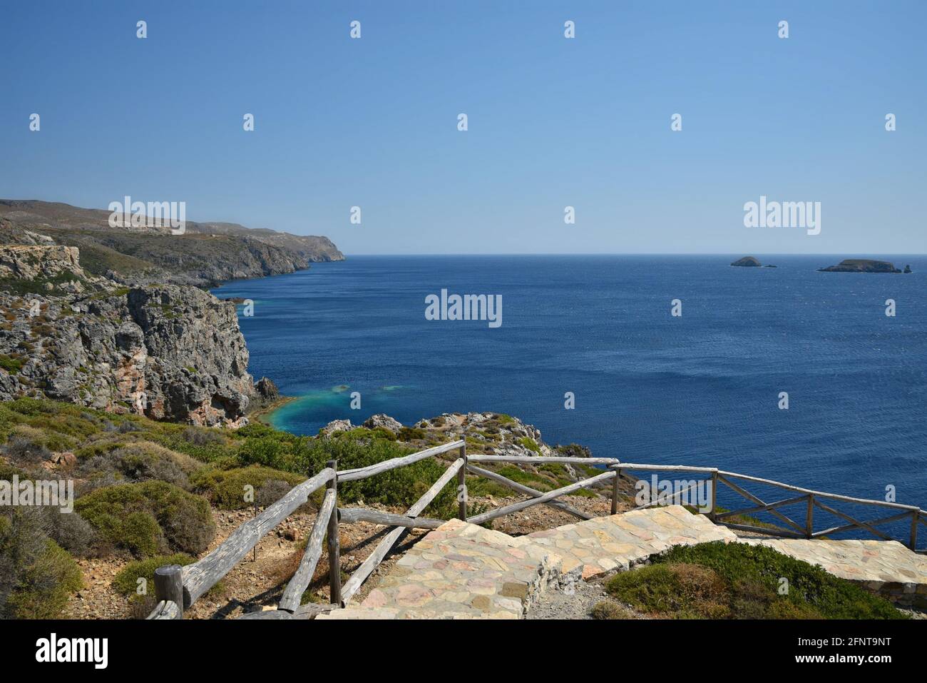 Slate steps with wooden railing leading to Aghios Nikolaos Krassas, a ...