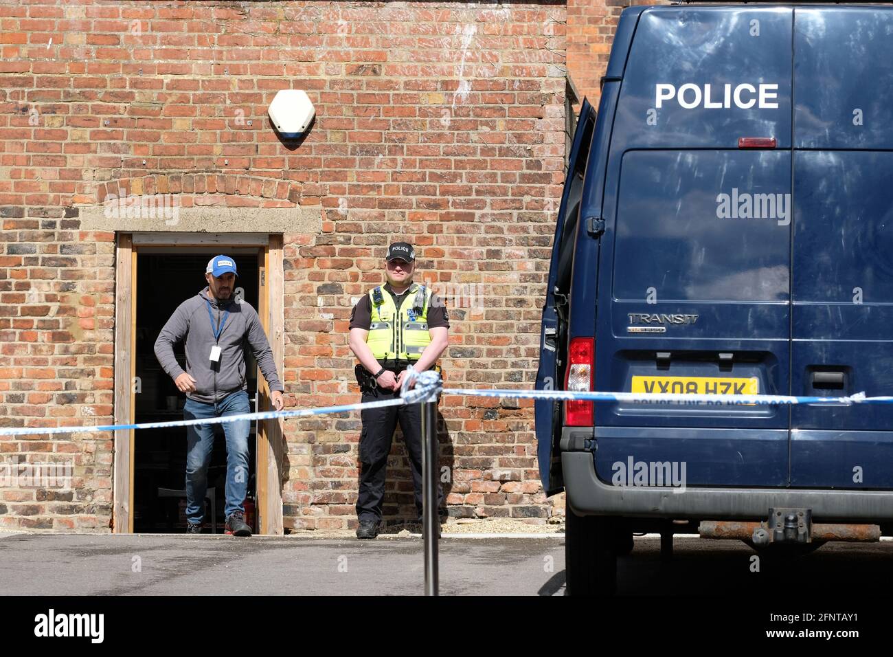 Gloucester, Gloucestershire, UK - Wednesday 19th May 2021 - Police officers at the rear of the Clean Plate cafe as Police begin excavations in the search for Mary Bastholm who went missing in 1968 aged just 15 years old and who may have been a victim of serial killer Fred West. Photo Steven May / Alamy Live News Stock Photo