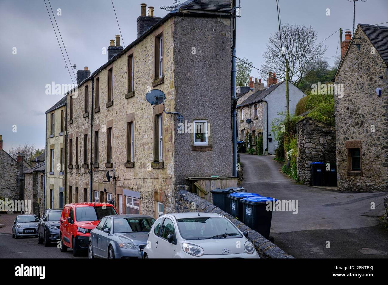 A narrow house on the corner terrace at the junction of Main Street and The Alley, Middleton, Derbyshire Stock Photo
