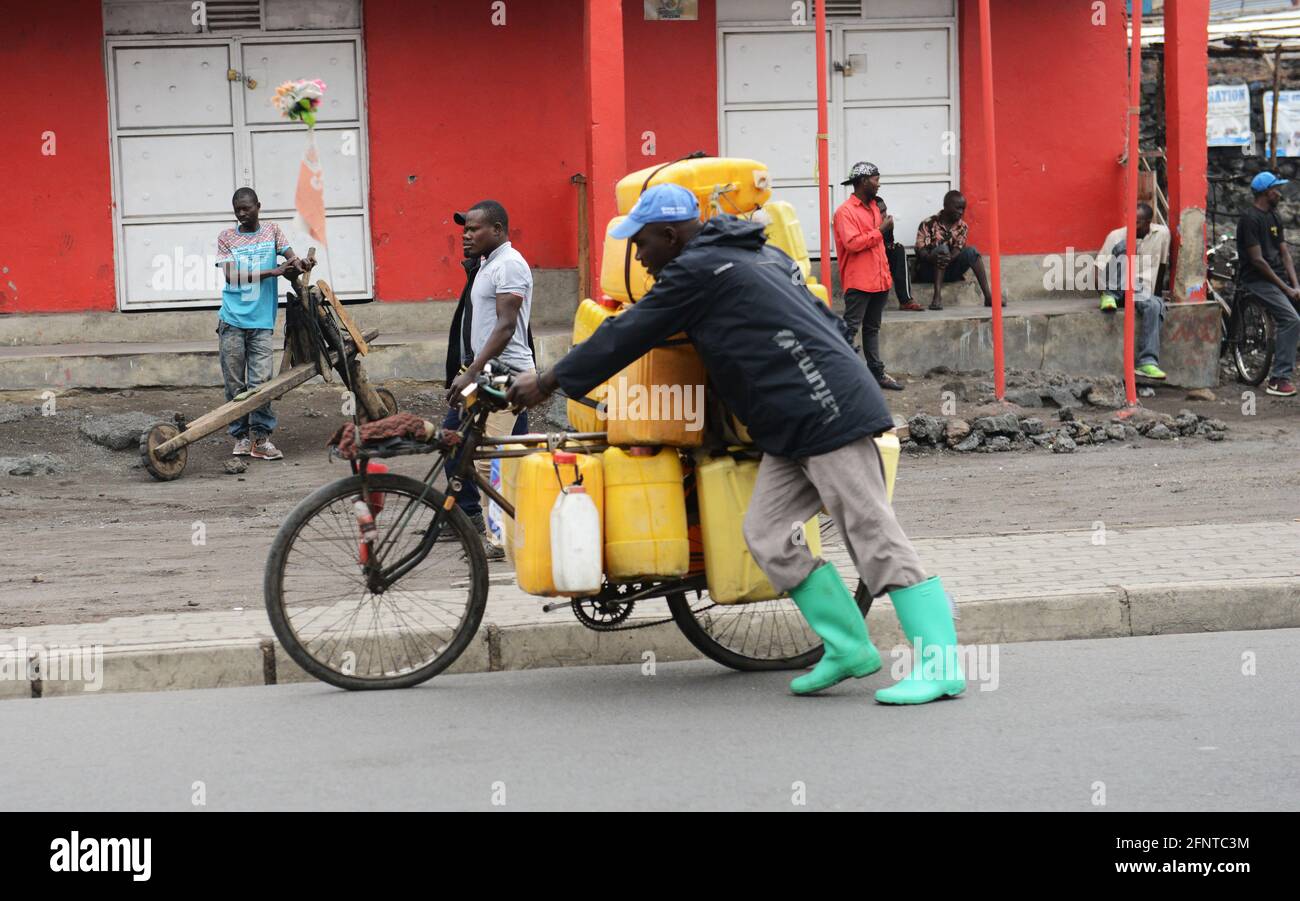 A Congolese man pushing his loaded bicycle in Goma, North Kivu province, D.R.C Stock Photo