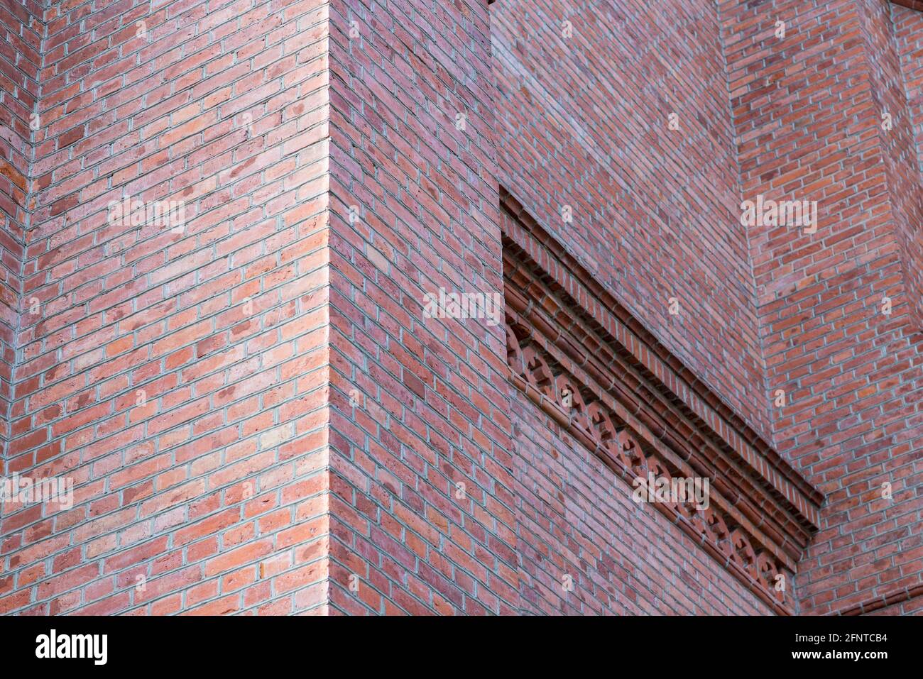 Fragment red brick wall catholic church nice background. Stock Photo