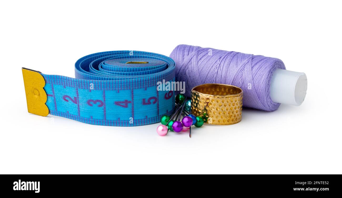 Tailor, needles and threads over white background Stock Photo