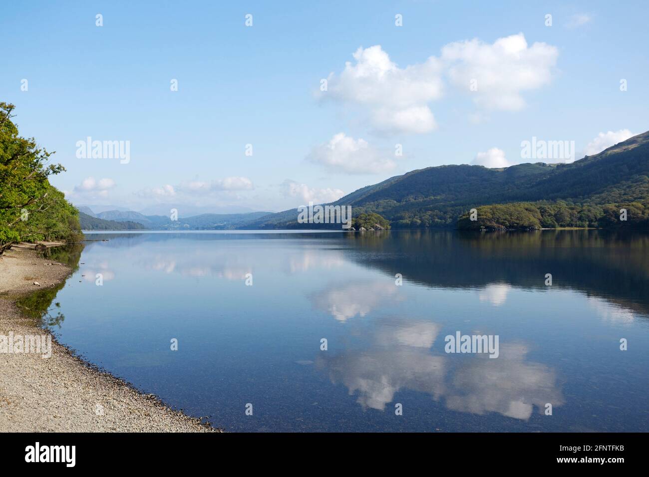 Stony beach at Coniston Water in Cumbria, England. The lake is in the Lake District National Park. Stock Photo