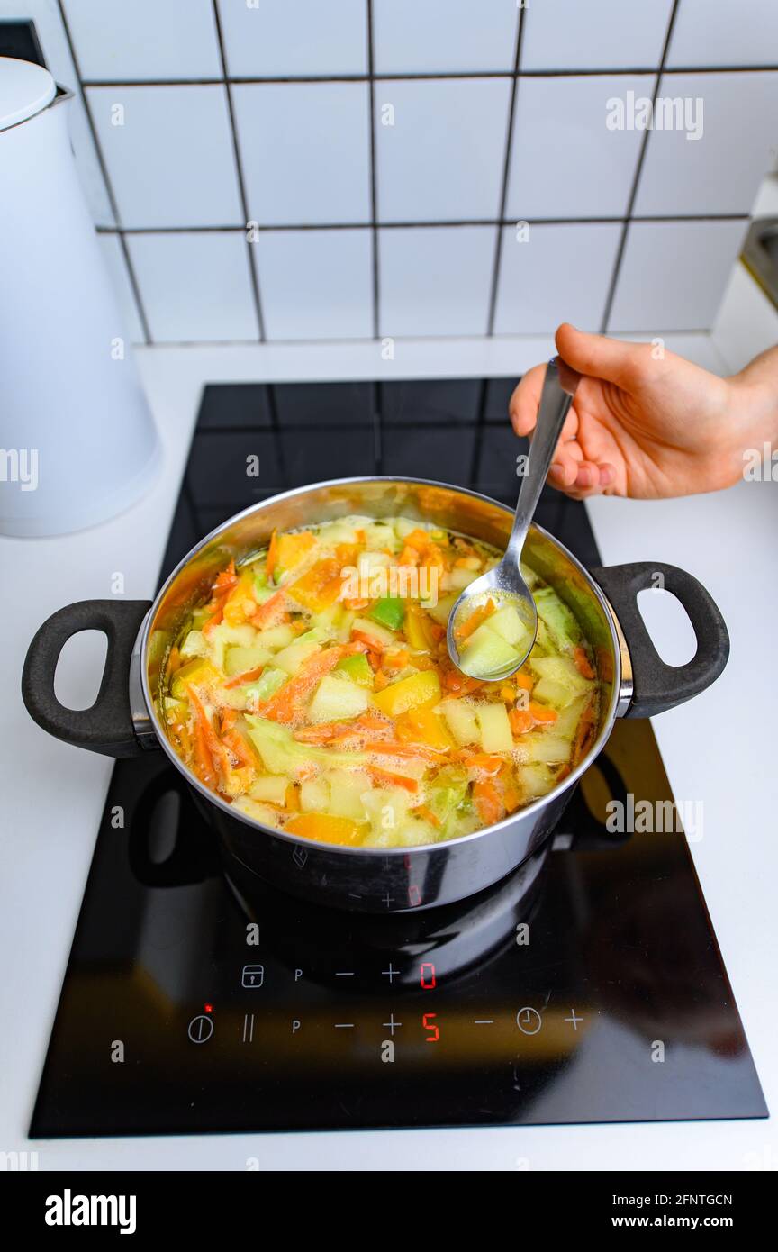 Cooking Bright Vegetable Soup on the Stove Stock Photo Alamy