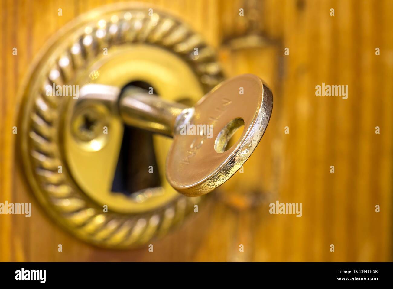 Close up of gold door key Stock Photo Alamy