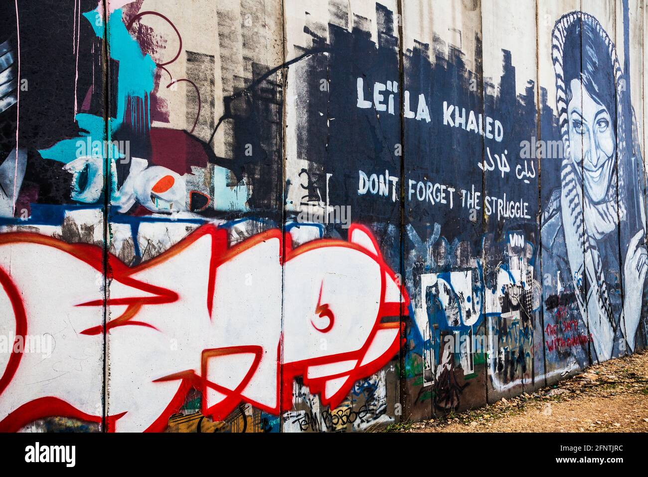 Graffiti of Leila Khaled on the Israeli West Bank Barrier near Bethlehem. Stock Photo