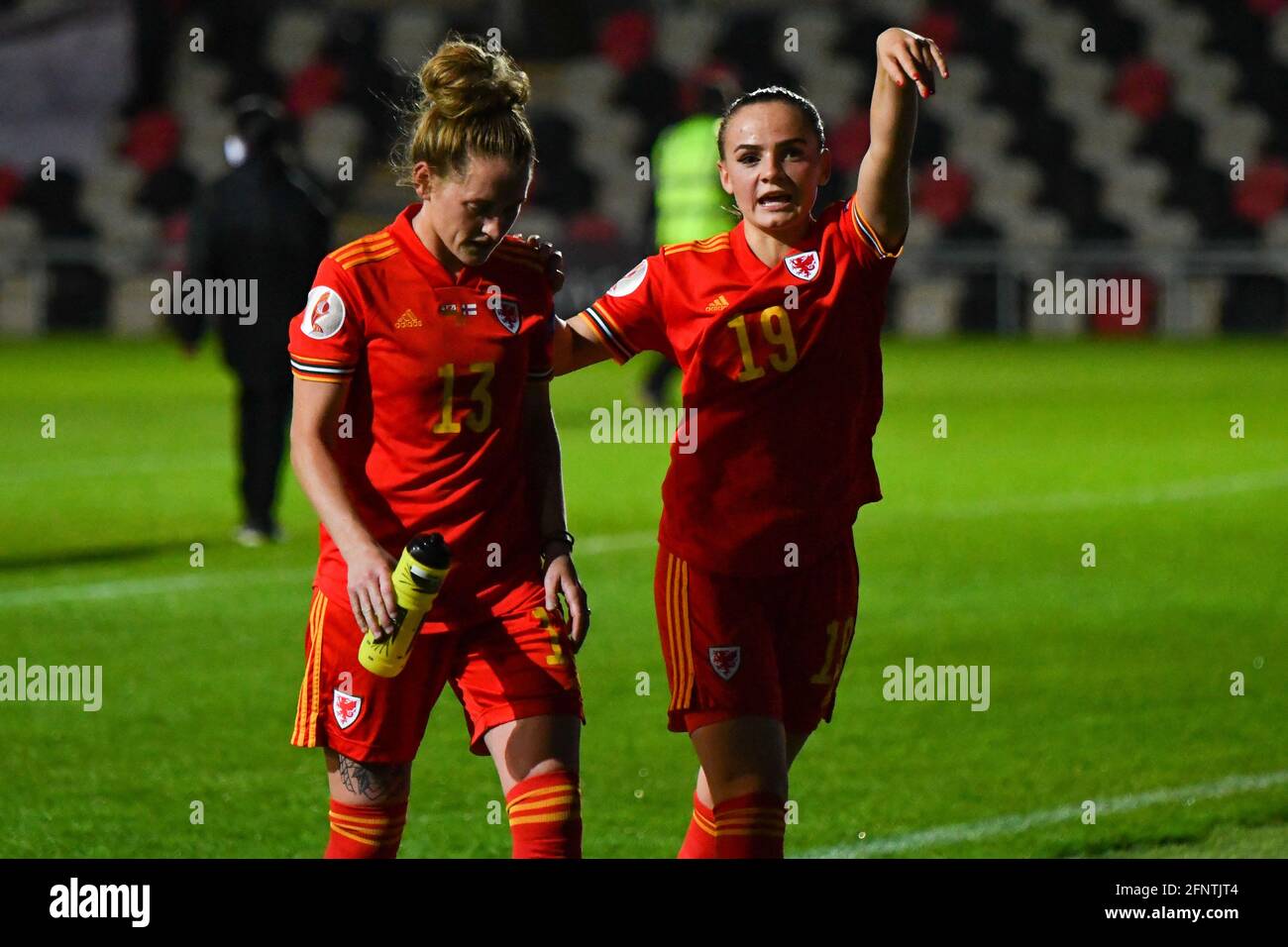 Newport, Wales. 22 October, 2020. Rachel Rowe (left) and Lily Woodham of Wales Women walk off the pitch after the UEFA Women's European Championship 2020 Qualifying Group C match between Wales and Faroe Islands Women at the Rodney Parade in Newport, Wales, UK on 22, October 2020. Credit: Duncan Thomas/Majestic Media. Stock Photo