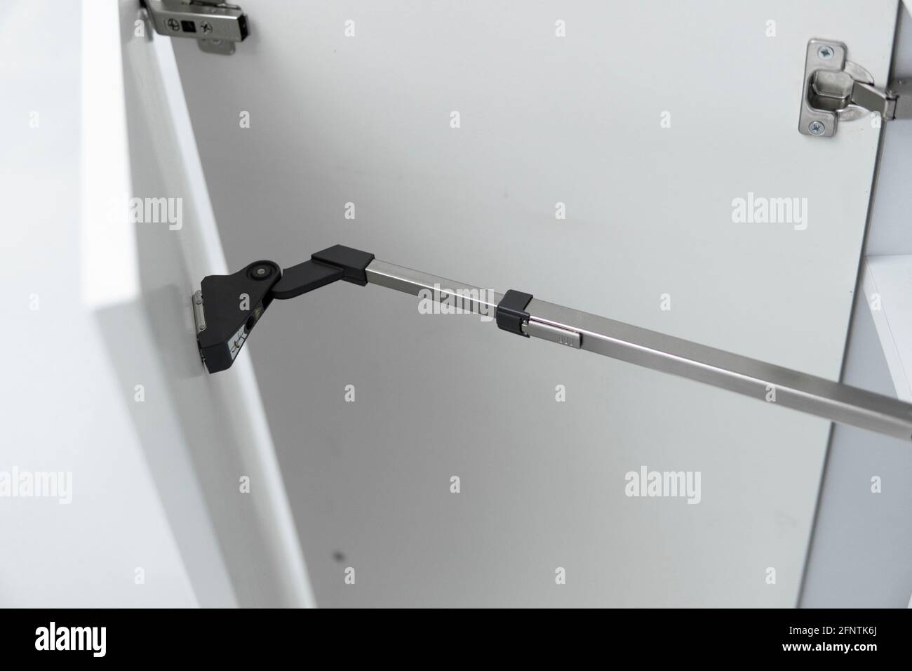 Kitchen with open fronts. Lift system for bifold fronts for direct access in kitchen