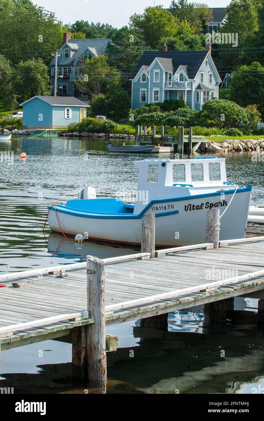 Small Commercial Fishing Boat Moored In Mahone Bay At Chester Village Nova Scotia, Canada Stock Photo
