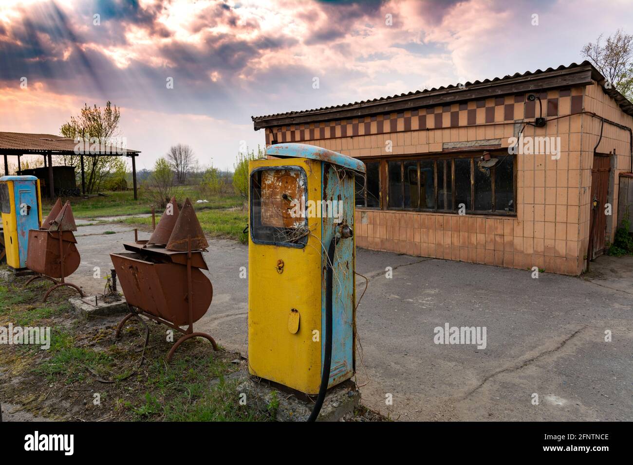 Old vintage gas station. Rusty dial with broken glass and inscriptions in Russian. Stock Photo