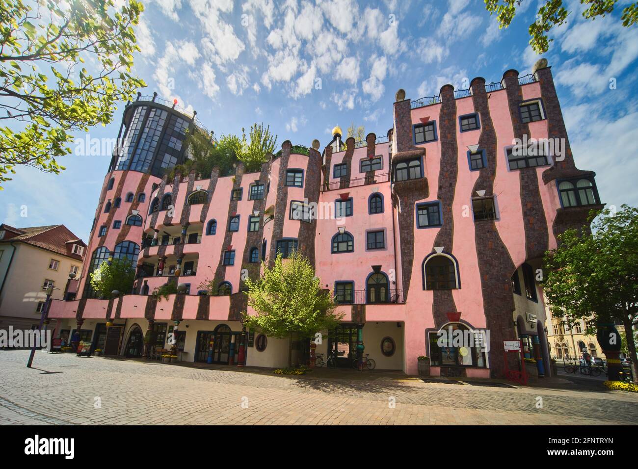 Magdeburg, Germany, May 13, 2021: Side view of the green citadel in Magdeburg, a residential building, commercial building and hotel of the artist Fri Stock Photo