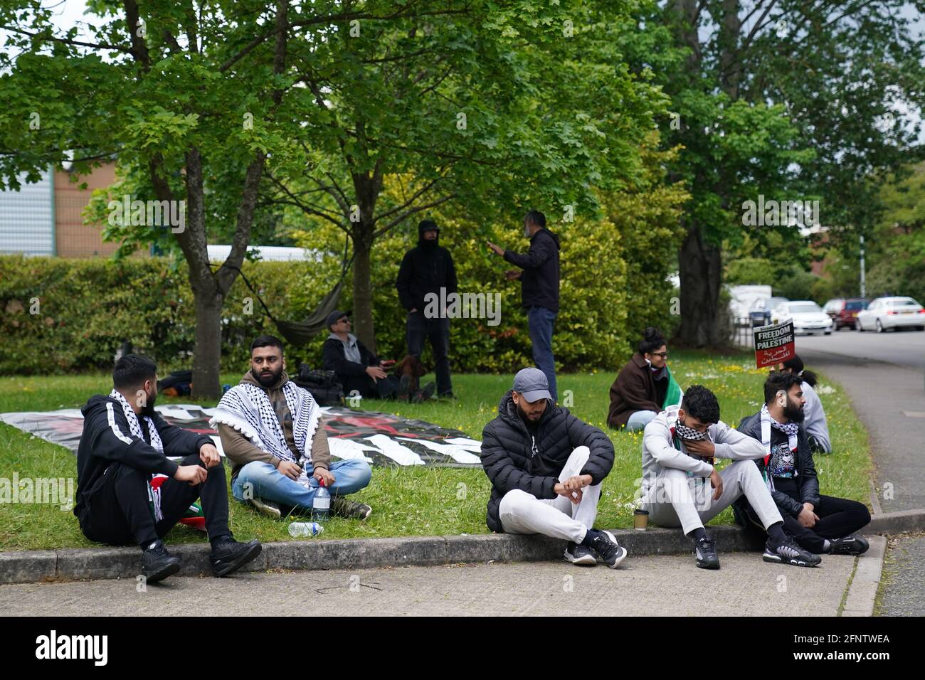 Protestors from Palestine Action outside the UAV Tactical Systems factory in the Meridian Business Park in Braunstone Town, Leicester. Picture date: Monday May 17, 2021. Stock Photo
