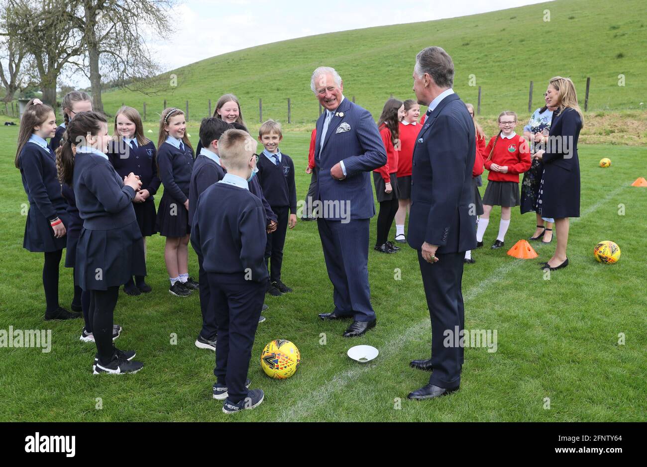 The Prince of Wales (centre) with Lord Caledon meeting school children