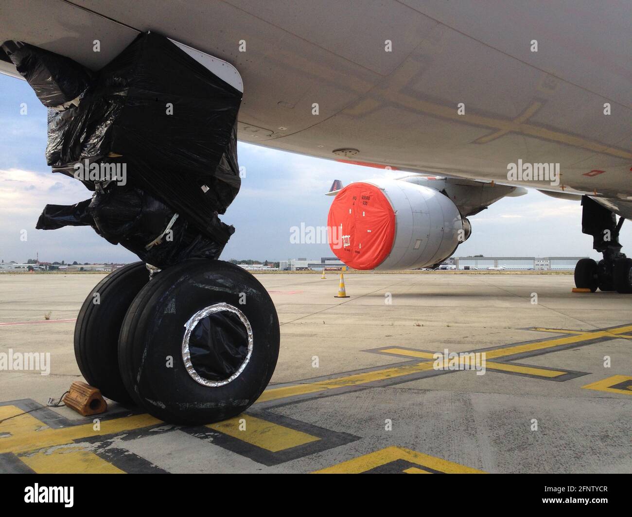 landing gear and jet engine sealed off during long term storage of the airplane Stock Photo
