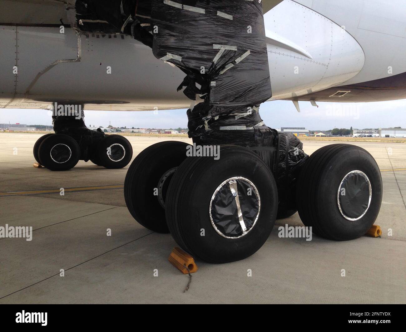 aircraft landing gear sealed off to protect from bird nesting during long term storage Stock Photo