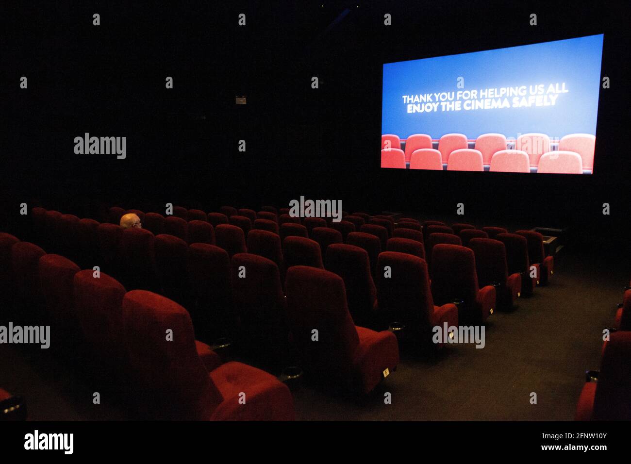 London, UK, 19 May 2021: The Clapham Picturehouse cinema reopens today for a lone lunchtime viewer but evening shows more booked up. The screens will opperate at less than 50% of capacity for social distancing and audiences are required to wear face masks. Anna Watson/Alamy Live News Stock Photo