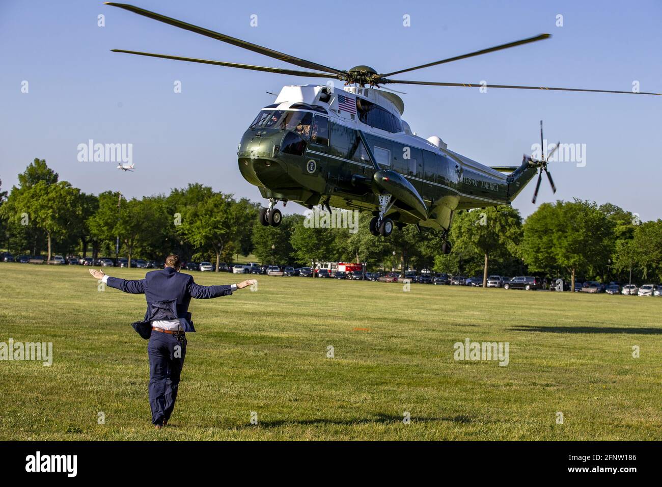 Washington, United States. 19th May, 2021. Ground Personal help land Marine One on the ellipse to transport US President Joe Biden at the White House in Washington, DC on Wednesday, May 19, 2021. President Joe Biden Departs White House for Connecticut for the US Coast Guards 140th commencement. Photo by Tasos Katopodis/UPI Credit: UPI/Alamy Live News Stock Photo