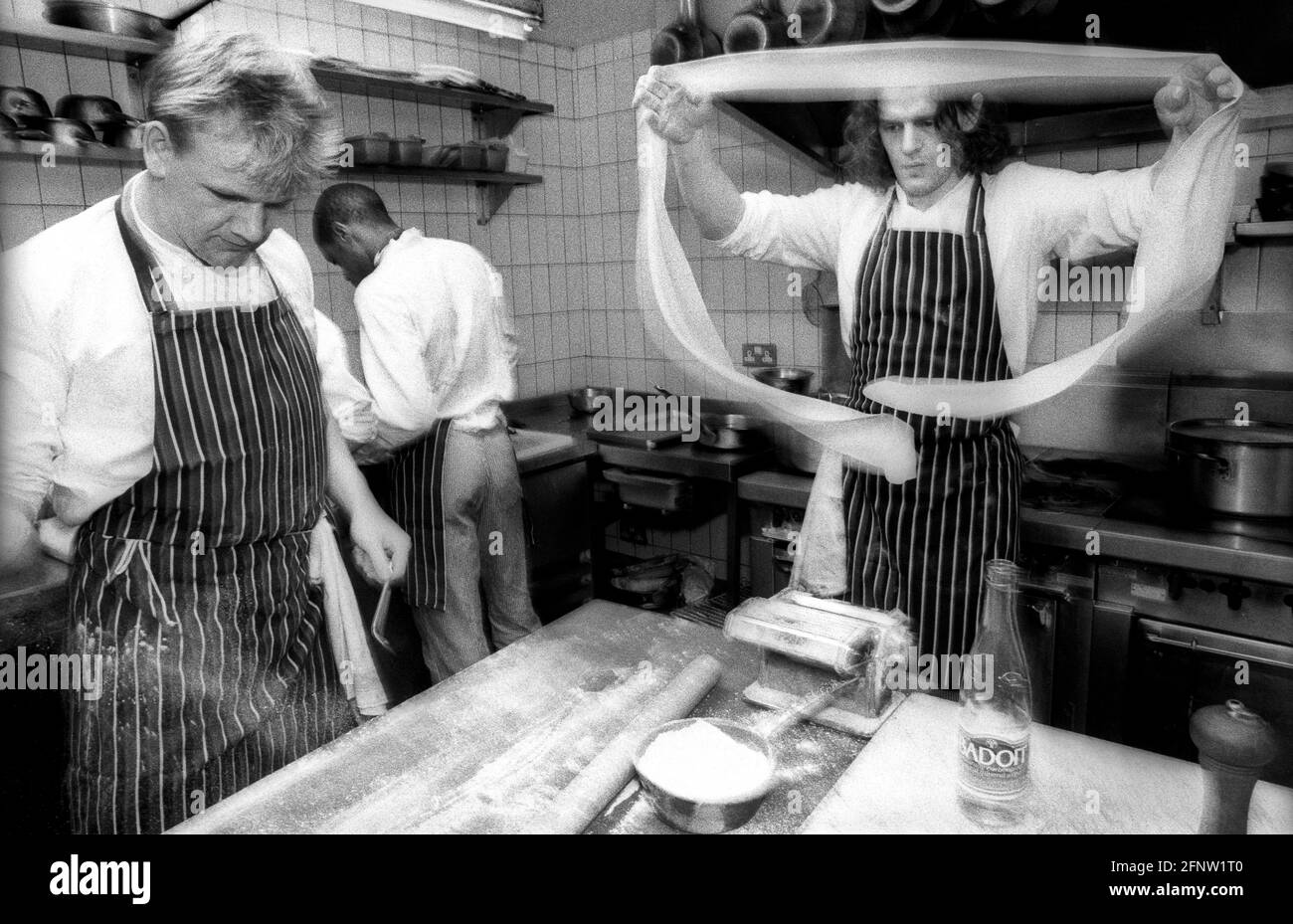 Celebrity chef Marco Pierre White with assistant or 2nd chef, Gordon Ramsey at Harvey's restaurant, during MPW's supremacy as London's top young chef. Stock Photo