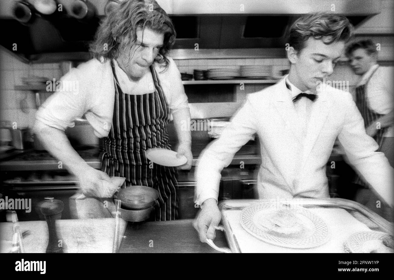 Celebrity chef Marco Pierre White with assistant or 2nd chef, Gordon Ramsey at Harvey's restaurant, during MPW's supremacy as London's top young chef. Stock Photo