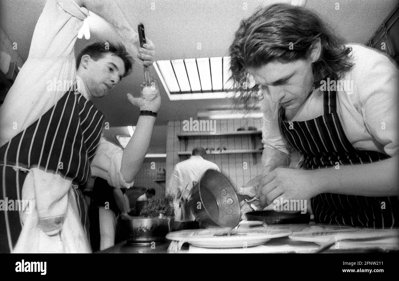 Celebrity chef Marco Pierre White with assistant or 2nd chef, Gordon Ramsey at Harvey's restaurant, during MPW's supremacy as London's top upcoming yo Stock Photo