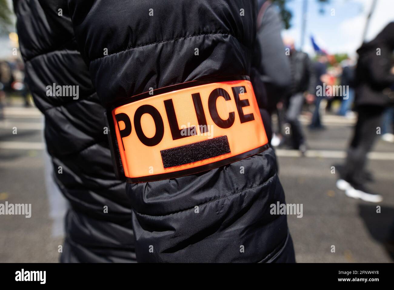 Paris, France May 19, 2021, Police officers wear a police armband as they  gather for a rally in front of the Assemblee Nationale ( french National  Assembly ) in Paris on May